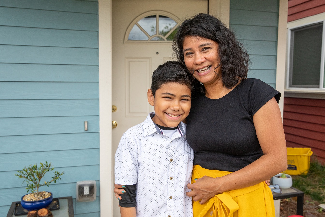 PORTLAND, OREGON (07/26/2019)-Lizet Molina Neri and her son, Alan (9), in front of the Habitat home that she helped build. ©Habitat for Humanity International/Jason Asteros
